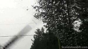 a redhead teen relaxes in the car outdoors