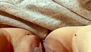 Milf opens her pussy wide.