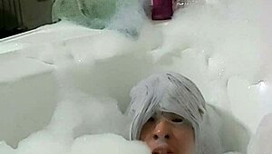 Cyno enjoys solo bubble bath fun in cosplay.