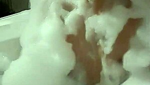 Cyno enjoys solo bubble bath fun in cosplay.