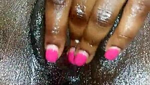 Black ebony woman masturbates in close up