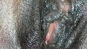 Black ebony woman masturbates in close up
