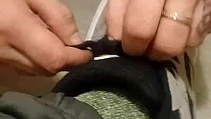 Why is my friend having so much fun trashing my sneakers? Provocative foot fetish scene.