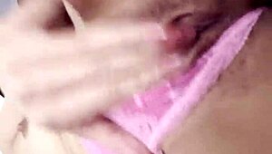beautiful latina relaxes with self-massage on rainy afternoon