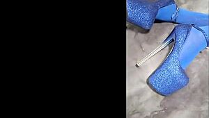 admiring sexy pantyhose paired with blue high heels