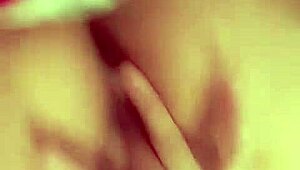 is this redhead slut fingering her hairless pussy for you?