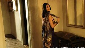 She dances the erotic veil striptease.