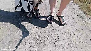 this mature german woman goes barefoot in birkenstocks through the european outdoor nature, enjoying a public fetish vibe.