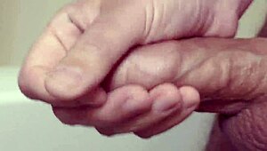 amateur guy masturbates close up with slow motion cumshot on his solo cock