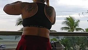 Exhibitionist flashing ass under skirt on balcony