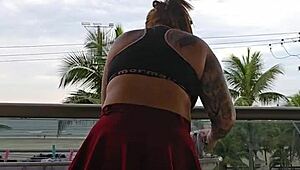 Exhibitionist flashing ass under skirt on balcony