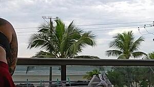 Exhibitionist flashing ass under skirt on balcony