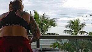 Exhibitionist flashing ass under skirt on balcony