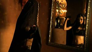 Beautiful brunette from Bollywood dances in a cute teasing way.