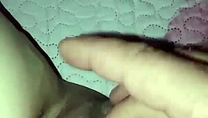 In a homemade video, an amateur pregnant milf experiences a quick slap in an intimate moment.