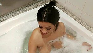 What happens when a curvy Brazilian teen gets naughty in the tub, showing off her big assets?