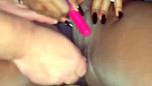 Sexy black model shoves vibrator deep in shaved pussy for white guy watching!