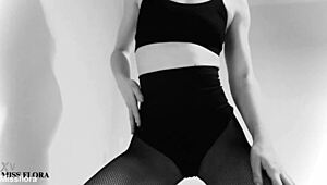 this brunette babe teases in fishnet tights, showing off her ass and feet. she poses in black and white for an interracial fetish vibe.