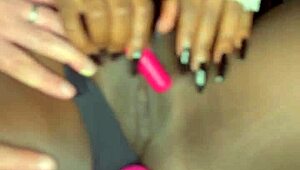 Sexy black model shoves vibrator deep in shaved pussy for white guy watching!