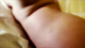 I strip down on the bed showing my big tits and brunette curves with teasing licks