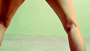 Young Indian teen bends over, showing wet pussy in solo play.