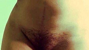 Young Indian teen bends over, showing wet pussy in solo play.