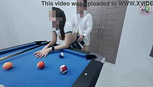 that thai girl hints at climbing the pool table for some intense action in her uniform
