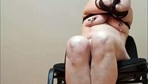 Amateur milf bends over as SLUT SLAVE in homemade BDSM session. She endures humiliation on the chair like a true whore.