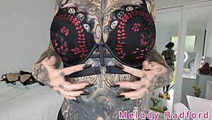 melody radford tries on black and purple lingerie plus micro bikini in this solo haul