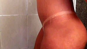 blonde brazilian teen explores her big ass while masturbating in the bath.