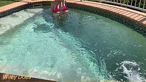 Hey, check out my wife flashing her big tits in the hotel pool during our daring public exhibitionist adventure.