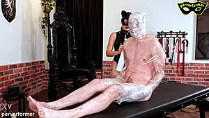 Wrapped in 100 meters of foil for total bondage control! Bound slave punished!