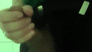 In the mall bathroom, the security guard casually takes a break to masturbate solo.