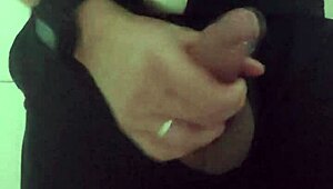 In the mall bathroom, the security guard casually takes a break to masturbate solo.