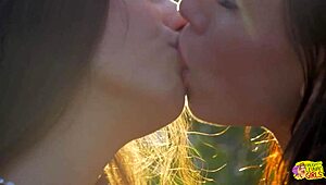 Two lesbians run through outdoor field then kiss with big clit licking masturbation and passionate pussy sex on grass
