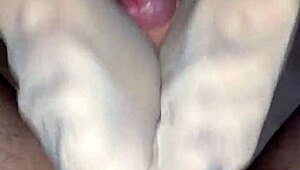 Hey, check out this homemade nylon footjob ending in a messy cumshot on her feet