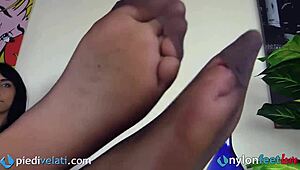 Tattooed brunette suicide girl in nylon pantyhose and leggings rips clothes while smoking cigarette