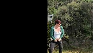Narrative of trashy Kiwi milf pissing on roadside amid traffic in outdoor public scene