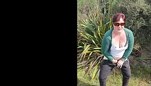 Narrative of trashy Kiwi milf pissing on roadside amid traffic in outdoor public scene