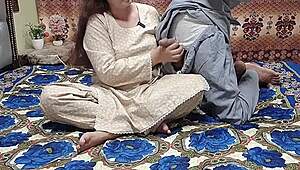 In a bedroom setting, a Pakistani girl is bent over and engaged in doggystyle by her Arabic boss, featuring amateur aunt elements with Hindi audio.