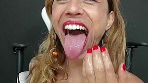 Nasty milf fists her mouth and pussy in this promo. She's a squirting Brazilian goddess with big pussy lips.