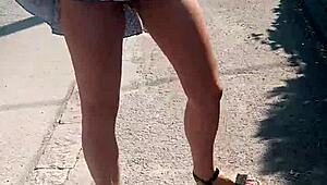 Boldly stripping naked on the busy street for public thrill