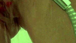 Hey, check out this horny babe masturbating to orgasm in the shower