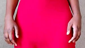 This sexy African lady teases by revealing her alluring tits