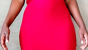 This sexy African lady teases by revealing her alluring tits