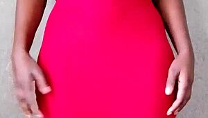 This sexy African lady teases by revealing her alluring tits