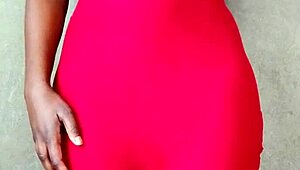 This sexy African lady teases by revealing her alluring tits