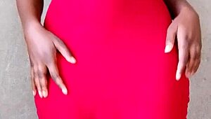 This sexy African lady teases by revealing her alluring tits