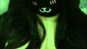 a goth girl teases her massive tits live on webcam.