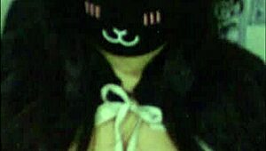 a goth girl teases her massive tits live on webcam.